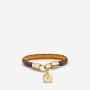 Louis Vuitton Monogram Tribute Bracelet in mono canvas with gold-tone hardware